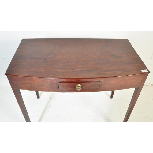 546 - An early 19th Century Georgian Regency mahogany side table. The serving table with bow front being r... 