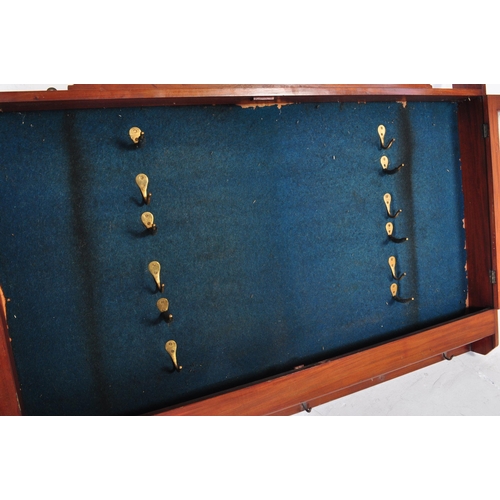 552 - An early 20th century mahogany gunsmiths shooting gun stock cabinet. Twin glazed door with notation ... 