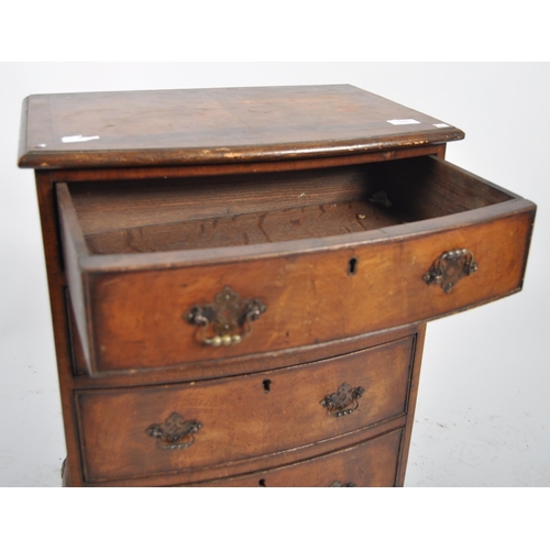 556 - An 18th Century George III and later bow fronted chest of drawers of small proportions. The bachelor... 