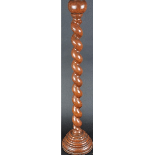 557 - A 19th century English oak barley twist church altar candlestick holder.  The tall barley twist shap... 