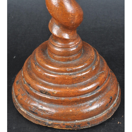 557 - A 19th century English oak barley twist church altar candlestick holder.  The tall barley twist shap... 