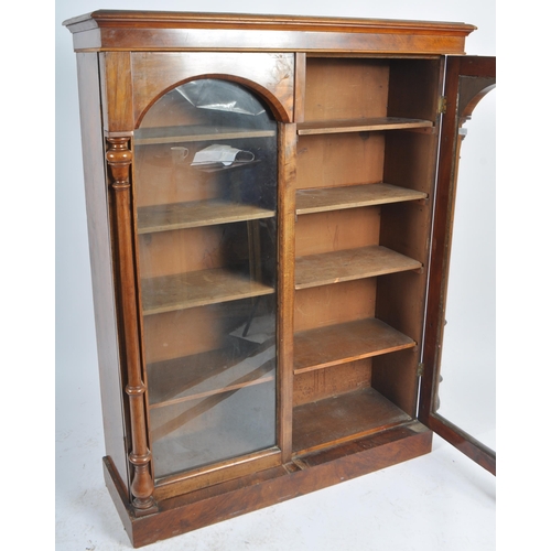 56 - A 19th Century Victorian walnut library bookcase cabinet vitrine. Flared pediment top with twin glaz... 