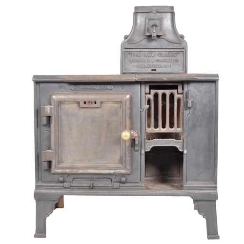 563 - A 19th Century Victorian cast iron oven stove - The New Canic. Nameplated chimney to top with lockin... 