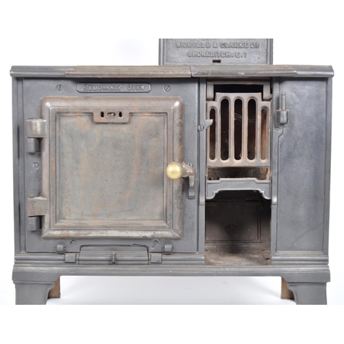 563 - A 19th Century Victorian cast iron oven stove - The New Canic. Nameplated chimney to top with lockin... 