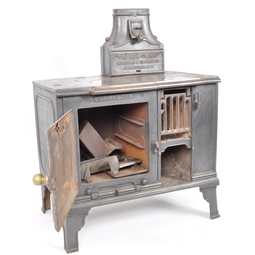 563 - A 19th Century Victorian cast iron oven stove - The New Canic. Nameplated chimney to top with lockin... 