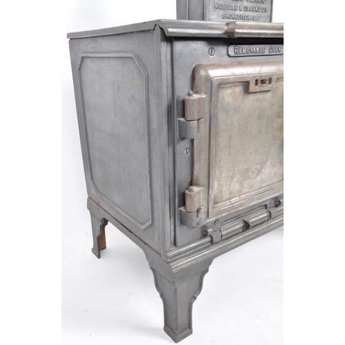 563 - A 19th Century Victorian cast iron oven stove - The New Canic. Nameplated chimney to top with lockin... 