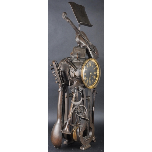 575 - A 19th Century French Aubert of Paris bronze worked music clock in the form a lectern adorned with m... 