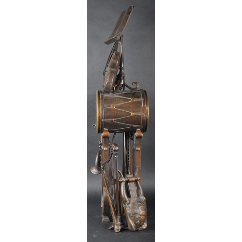 575 - A 19th Century French Aubert of Paris bronze worked music clock in the form a lectern adorned with m... 