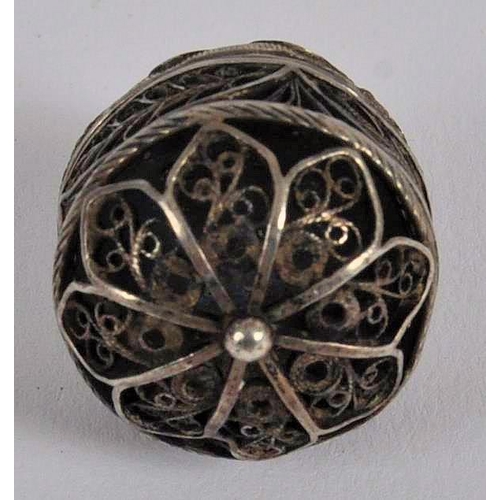 576 - An 18th century German silver pomander. Of circular / domed filigree form, The pomander separates in... 