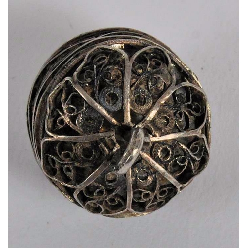 576 - An 18th century German silver pomander. Of circular / domed filigree form, The pomander separates in... 