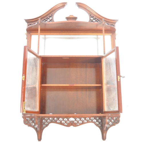 578 - A 19th Century Victorian mahogany having display cabinet having a fret pierced arched top with mirro... 