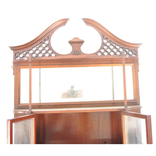 578 - A 19th Century Victorian mahogany having display cabinet having a fret pierced arched top with mirro... 