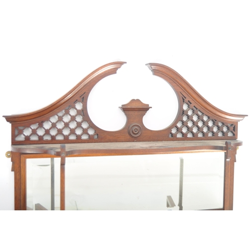 578 - A 19th Century Victorian mahogany having display cabinet having a fret pierced arched top with mirro... 