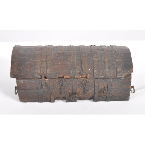 580 - A 19th century model of a 15th Century medieval chest. An iron bound oak wooden chest, with iron str... 