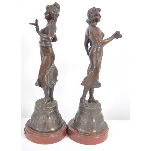 582 - A pair of 19th Century French Art Nouveau spelter figures depicting classical ladies in full garment... 