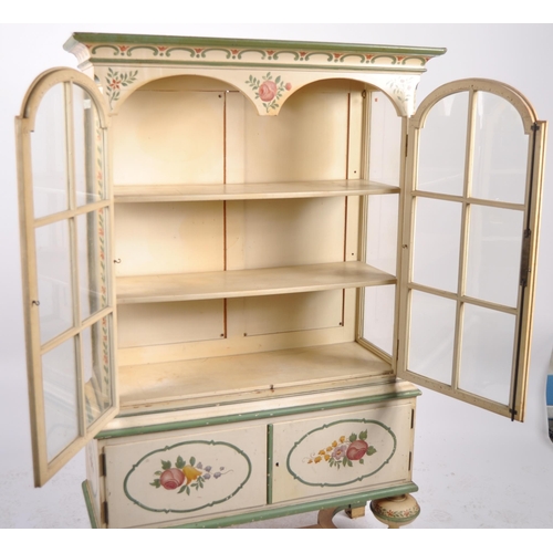 598 - A 19th Century Dutch painted display cabinet bookcase vitrine with moulded cornice, arched glazed do... 