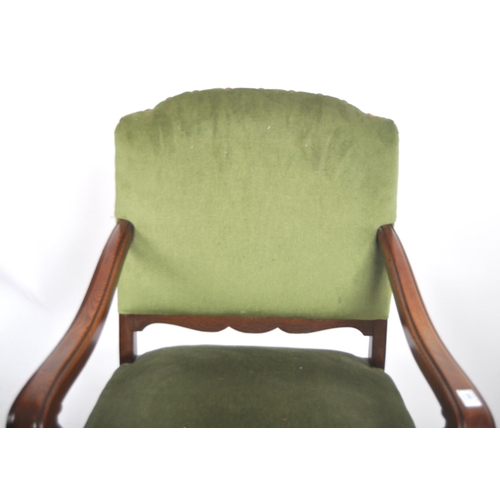 599 - A 19th Century Victorian mahogany armchair / arm chair. Green upholstery to the backrest and seat wi... 