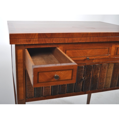 601 - A 19th Century satinwood writing table desk having a fold over top with series of drawers above a si... 