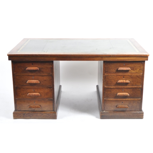 610 - A large 20th Century Victorian oak twin pedestal writing table desk. Green gilt tooled leather writi... 