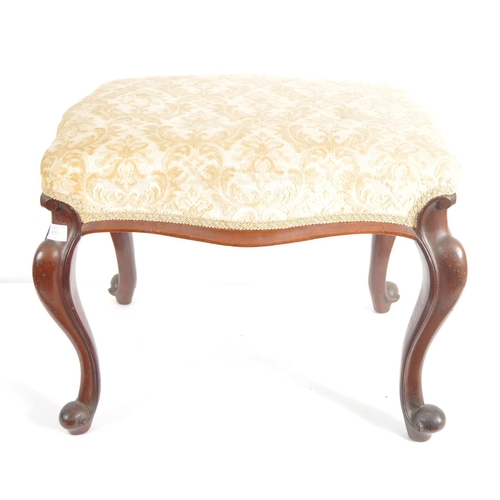 617 - A 19th Century mahogany footstool / piano stool. Overstuffed cushioned seat with gold & cream uphols... 