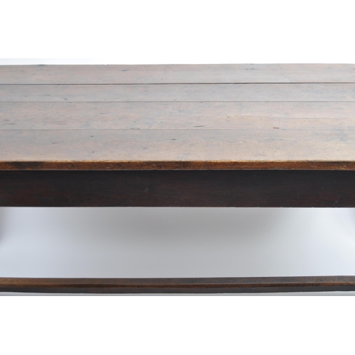 618 - A 19th Century oak four plank refectory dining table. The large table top raised on thick square blo... 