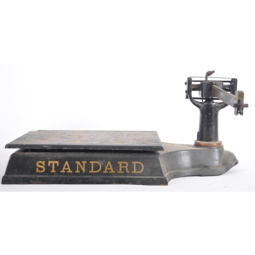 619 - A 19th Century Victorian set of cast iron Standard scales. Cast iron block base with gilt lettering ... 