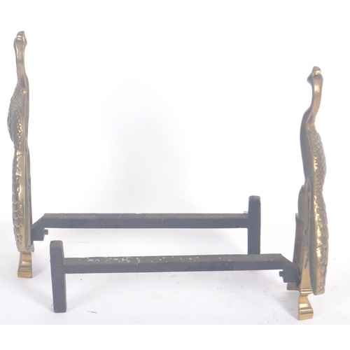 62 - A pair of 19th Century Victorian brass fireside peacocks. Ornate with cast features set to cast blac... 