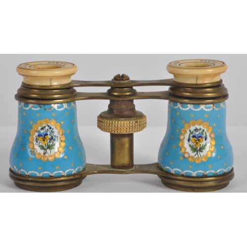 621 - A pair of 19th Century French gilt brass opera glasses. Typical form with blue porcelain panels to t... 