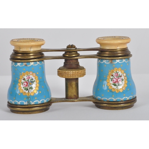 621 - A pair of 19th Century French gilt brass opera glasses. Typical form with blue porcelain panels to t... 