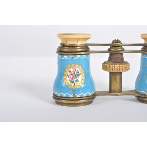 621 - A pair of 19th Century French gilt brass opera glasses. Typical form with blue porcelain panels to t... 