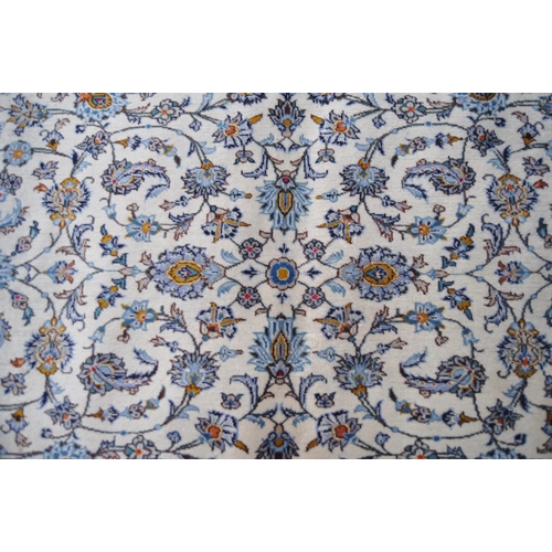 622 - A very large 20th Century Persian Islamic wool floor carpet rug. Cream ground with blue repeating fl... 