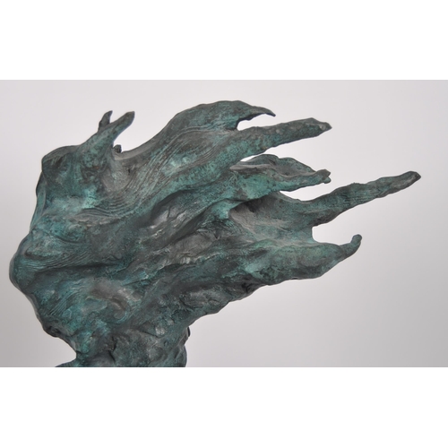 627 - A 20th Century modernist bronze sculpture of abstract form. The statue depicting a female violinist ... 