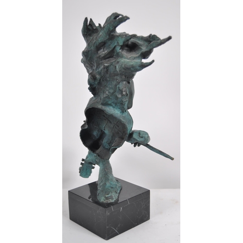 627 - A 20th Century modernist bronze sculpture of abstract form. The statue depicting a female violinist ... 