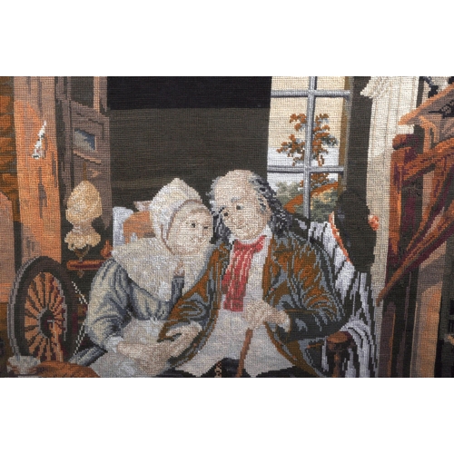 628 - A 19th Century German tapestry embroidery picture depicting an elderly couple seated with dog & cat ... 