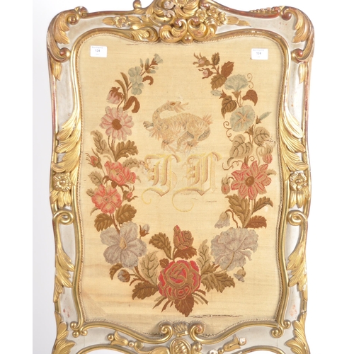 629 - A 19th Century gilt brass tapestry fire screen. Central embroidered panel set within gilt brass fram... 