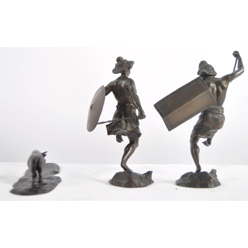 632 - A group of three 20th Century bronze figurines, two depicting warriors / hunters and the other depic... 