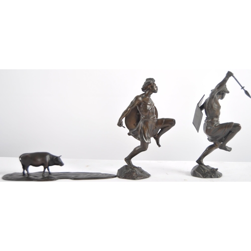 632 - A group of three 20th Century bronze figurines, two depicting warriors / hunters and the other depic... 