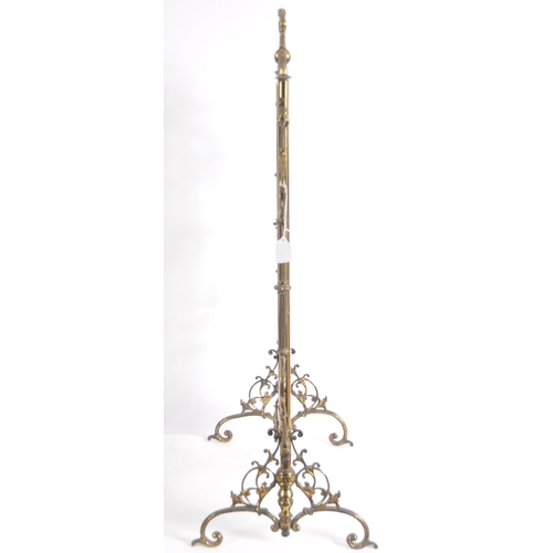 634 - A 19th Century Victorian brass fire screen. Ornate form with scrollwork frame and central glass mirr... 