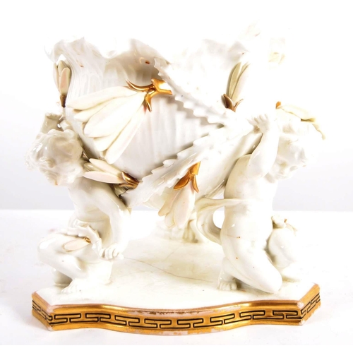 635 - A 19th Century Worcester manner porcelain figurine group centrepiece bowl depicting three cherubs ho... 