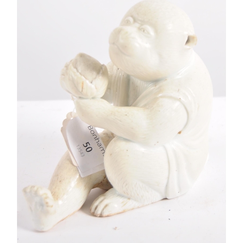 637 - A 19th Century Hirado (Japanese) porcelain monkey, late 19th Century, white glazed, modelled seated ... 