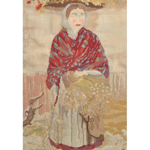 643 - A 19th Century Victorian tapestry embroidered picture depicting a woman in red shawl walking through... 