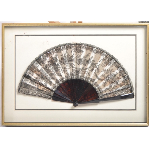 648 - A collection of three framed hand fans dating from the 19th Century comprising a black lace with tor... 