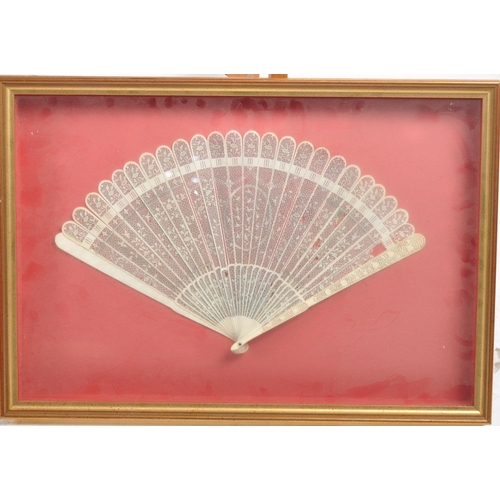 648 - A collection of three framed hand fans dating from the 19th Century comprising a black lace with tor... 