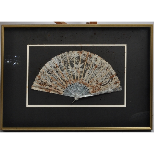 648 - A collection of three framed hand fans dating from the 19th Century comprising a black lace with tor... 