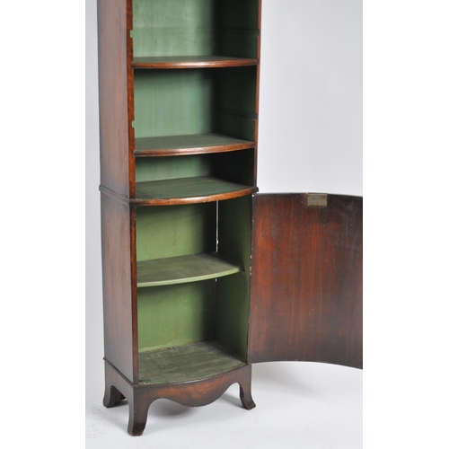 654 - A 19th Century walnut bookcase cabinet vitrine of slender proportions. Adjustable shelves with paint... 