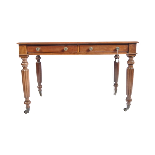 656 - A 19th Century Victorian mahogany writing table desk along with open arm chair. The desk with tooled... 