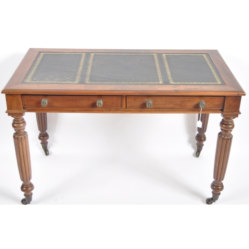 656 - A 19th Century Victorian mahogany writing table desk along with open arm chair. The desk with tooled... 