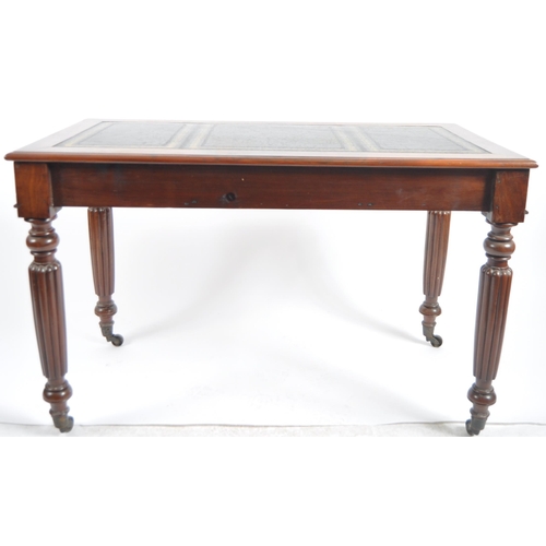 656 - A 19th Century Victorian mahogany writing table desk along with open arm chair. The desk with tooled... 