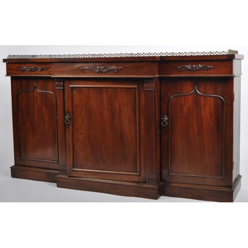 658 - A 19th Century Regency mahogany breakfront sideboard credenza cabinet having a brass gallery top wit... 