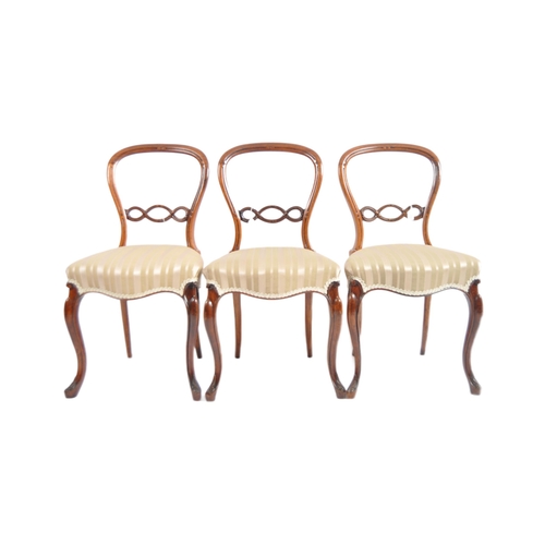 699 - A set of six 19th Century Victorian rosewood & mahogany balloon back dining chairs. Carved pierced b... 